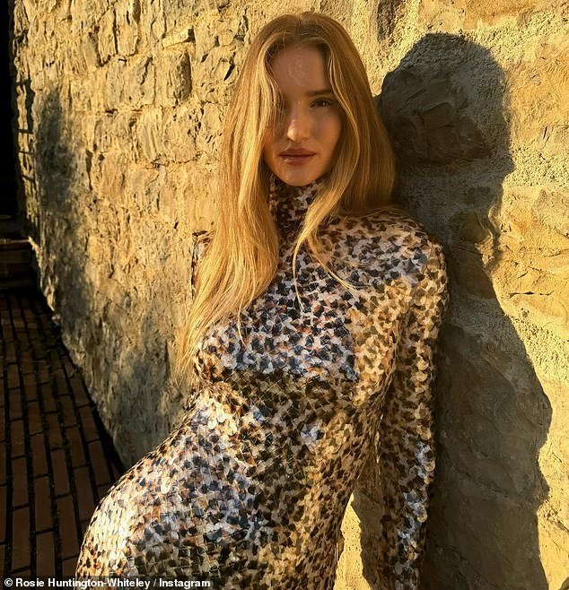 The supermodel looked sensational in a figure-hugging leopard print-inspired turtleneck and with her blonde hair down