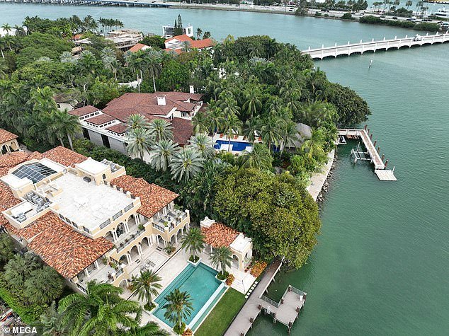 Law enforcement at Diddy's Star Island mansion in Miami Beach during a raid for alleged sex trafficking.  Federal agents are seen on the expansive waterfront