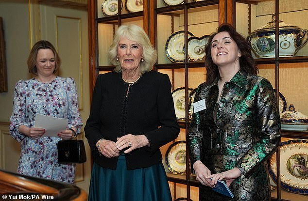 Queen Camilla (centre) and director of The Queen's Reading Room, Vicki Perrin (right) at a reception to celebrate the findings of a new study commissioned by the charity The Queen's Reading Room, at Clarence House