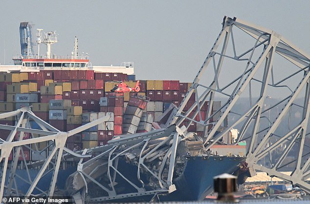 Stunning images show the mangled wreckage of the bridge, hours after it was struck by the cargo ship