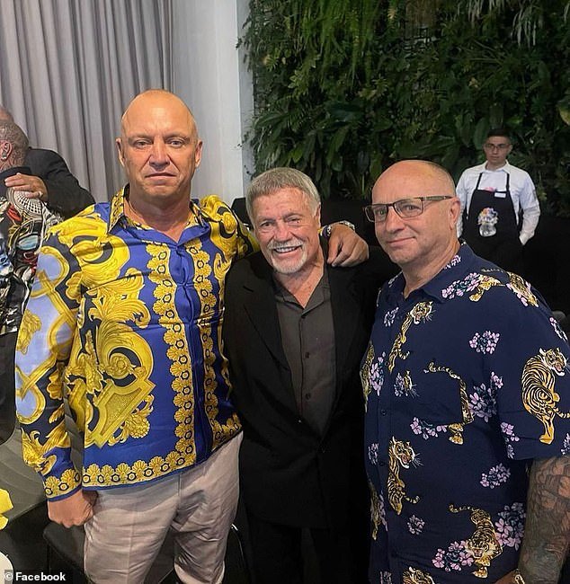 Russell Manser is pictured left in a Versace shirt with Dave Hedgcock (center)