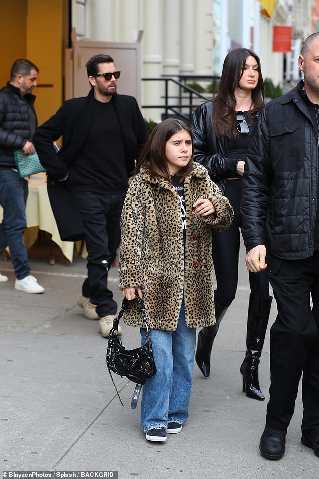 Penelope wore a leopard print coat while walking with Scott and Bella
