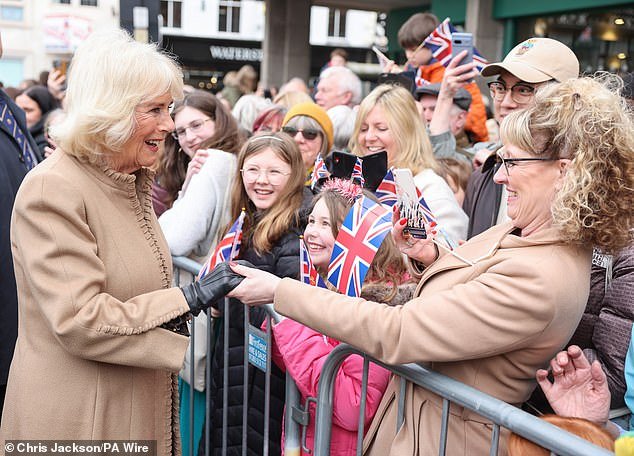 Queen Camilla greets well-wishers during a visit to the farmers' market in Shrewsbury