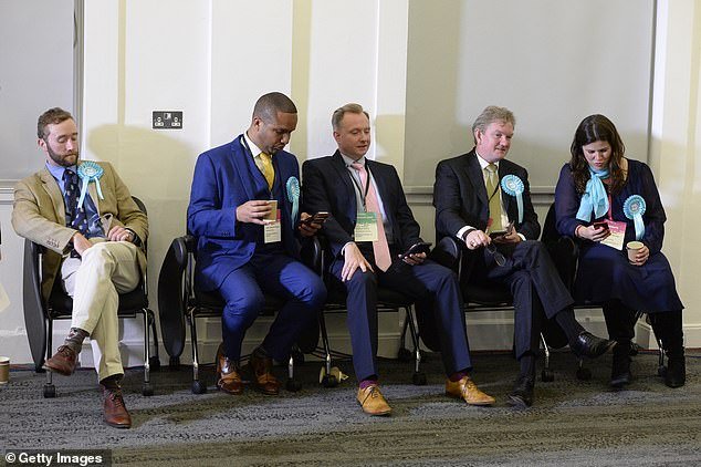 In Mr Ferguson's original post on had linked the injections to the nation.  The number of sudden deaths is increasing enormously.'  Pictured is Mr Ferguson (second from right) in May 2019