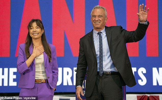 Independent presidential candidate Robert F. Kennedy Jr.  (right) announced his vice presidential pick, Bay Area entrepreneur and attorney Nicole Shanahan (left) at a rally Tuesday in Oakland, California