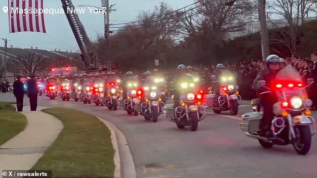 Thousands of law enforcement officers observed the arrival of Diller's body at the upstate New York funeral home where his service will be held Thursday.