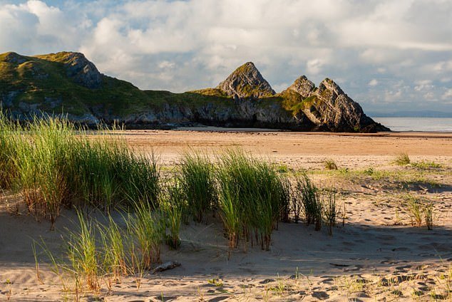 Above this lies Swansea's 'pristine' Three Cliffs Bay, which is surrounded by limestone cliffs and features a beach with dunes and a salt marsh that OS says can be explored at low tide.  OS grid reference: SS 53498 87797