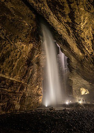 This is Gaping Gill in the Yorkshire Dales National Park, which yorkshiredales.org.uk states is one of the largest underground chambers in Britain.  The main chamber, he explains, is 129 meters long and 31 meters high.  OS grid reference: SD 75130 72733