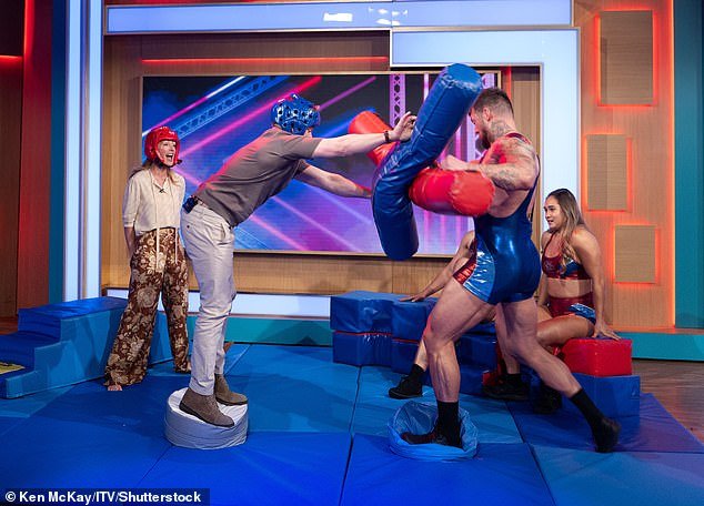 Ben admitted he was 'terrified' as he stood on a small stage with a padded punching stick hoping to knock Giant off the stage opposite
