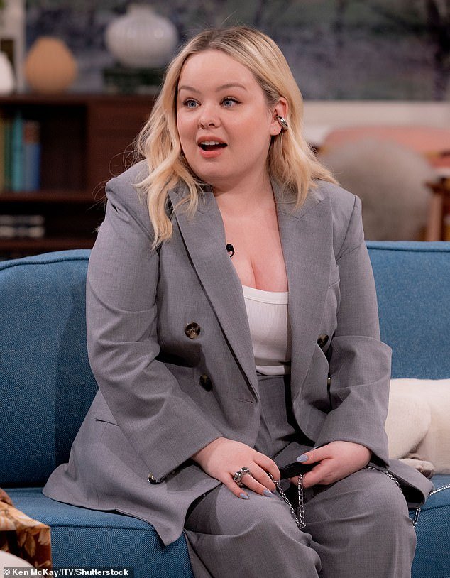 Dressed in a stunning gray suit and white vest, the Derry Girls star said: 