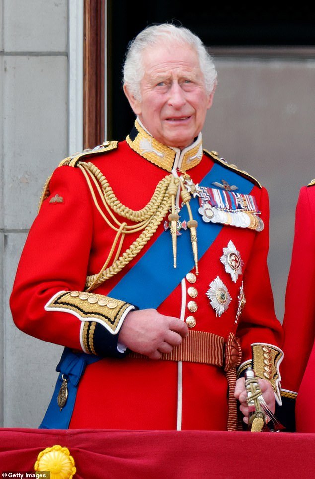 King Charles III (dressed in his Welsh Guards uniform) watches an RAF flyover from the balcony of Buckingham Palace during Trooping the Color on June 17, 2023 in London