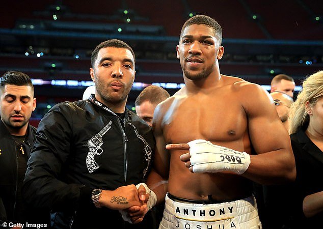 Troy Deeney (left) and Anthony Joshua (right) became friends after meeting in a barbershop