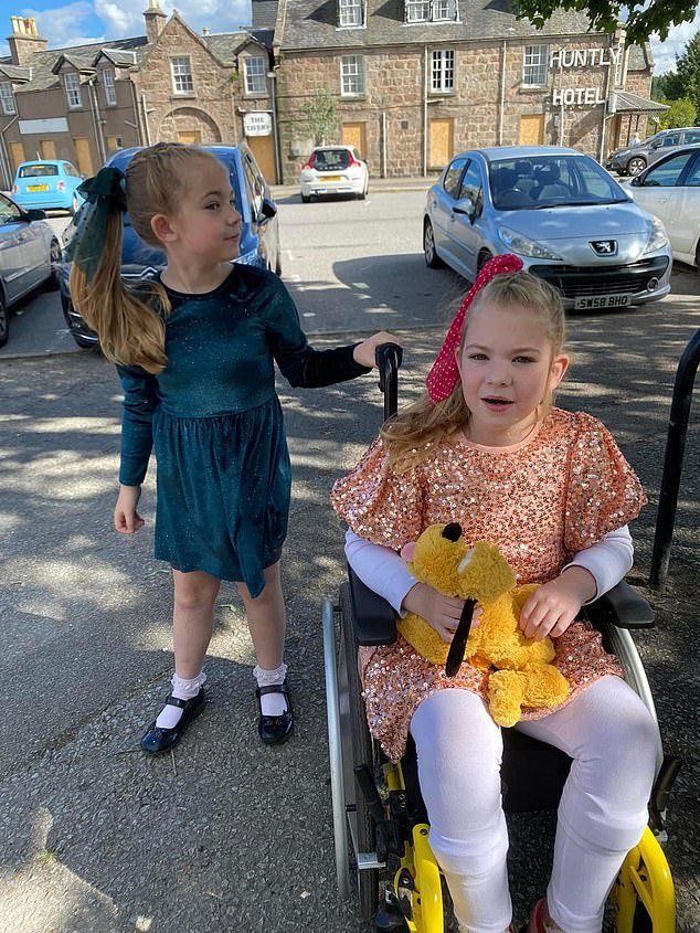 Lisa Boyd's nine-year-old daughter Lily Nicolson (pictured), who has cerebral palsy and uses a wheelchair, was also left out of one of the class photos, along with another boy