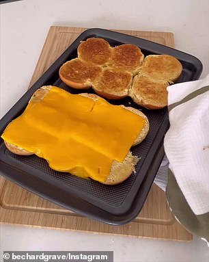 She does not separate the rolls, but cuts them in half, covers one half with slices of cheese and puts them in the oven to melt