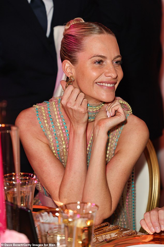 Poppy looked in good spirits as she attended the evening, sweeping her blonde locks back into a tight, sleek bun
