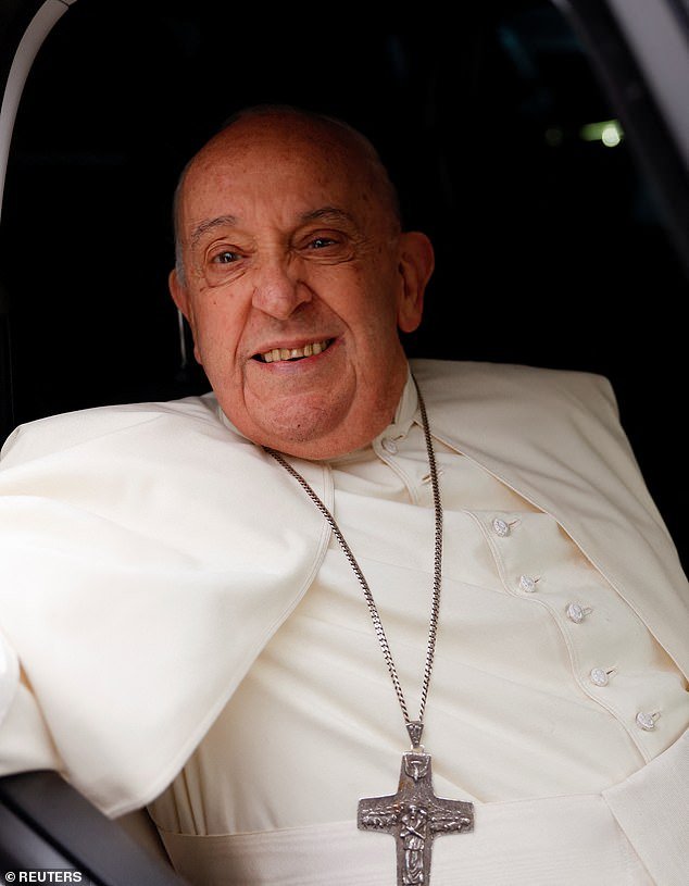 Pope Francis smiles as he leaves after visiting the women's section of Rebibbia prison