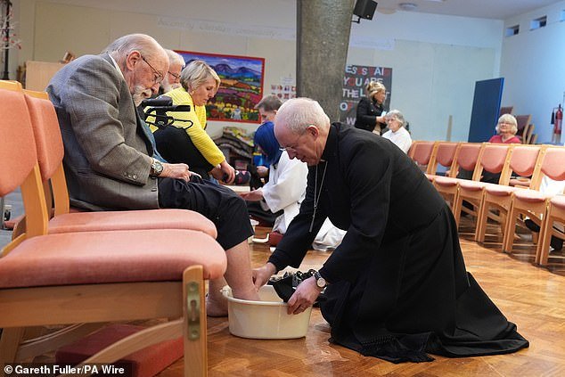 The Archbishop of Canterbury, Justin Welby, performs the Foot Washing Ceremony during the Sung Eucharist and Holy Thursday Liturgy at St Paul's Church, Maidstone