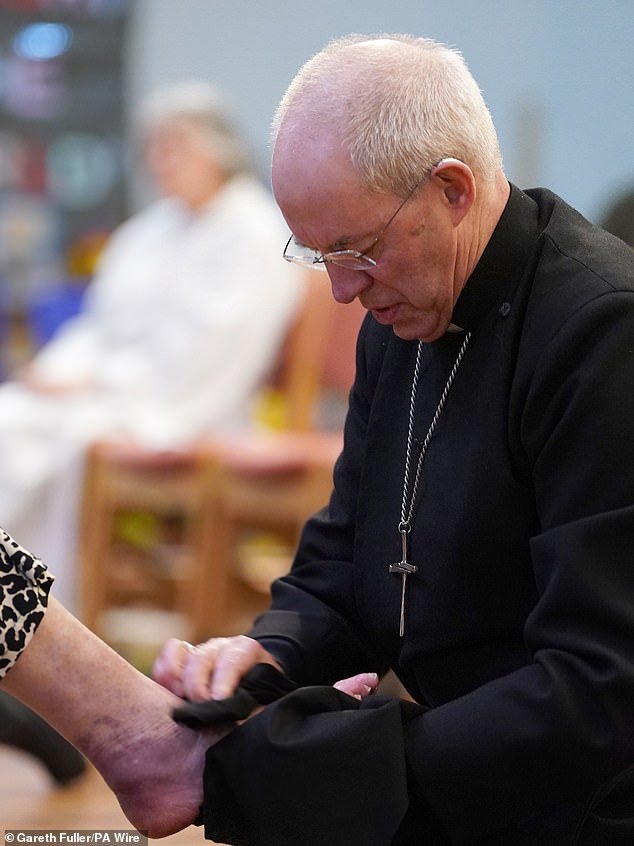 The archbishop performs the washing of the feet on Maundy Thursday, the day before Good Friday
