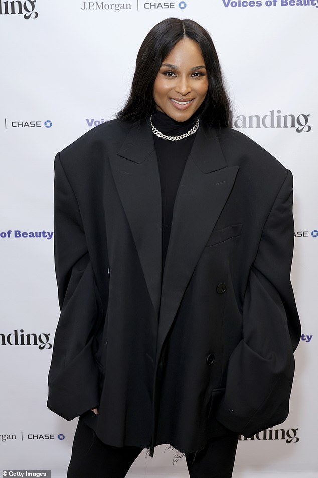 The singer, actress and entrepreneur showed off her infectious smile with her raven locks that were styled long, flowing and straight with a center parting