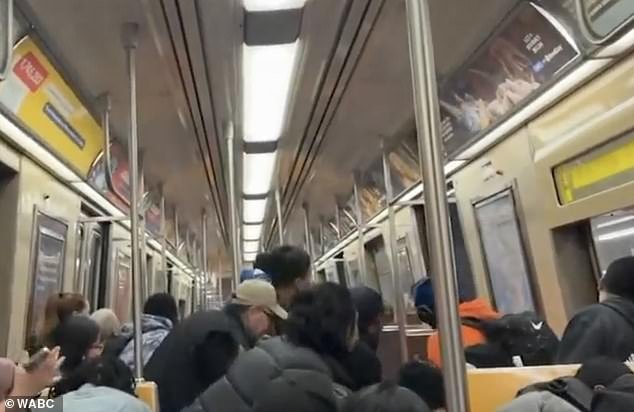 In separate footage taken after the shots were fired, a train car full of people was seen cowering in fear and pleading for the subway to stand down from crime.