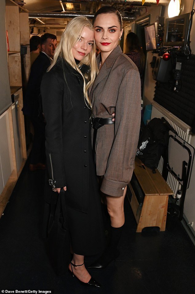 Anya looked cheerful as she posed next to Cara Delevingne