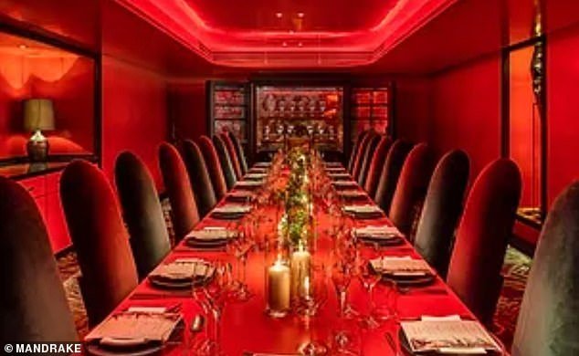 The event took place in the hotel's 20-seat private dining room, with a huge champagne fridge in the background.  The hotel says the room is 'Ideal for private gatherings, meetings, private dinners and events'