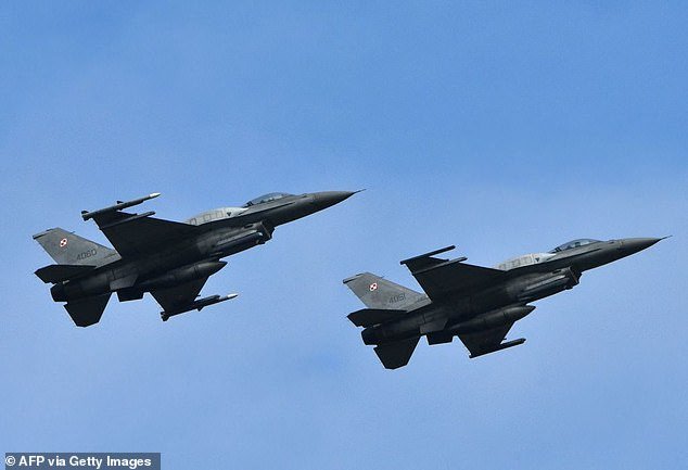 Last night's bombing of Ukraine prompted Poland to deploy its own fighter jets to protect its airspace from wayward drones, missiles or bombers (FILE: Polish F-16s in flight)