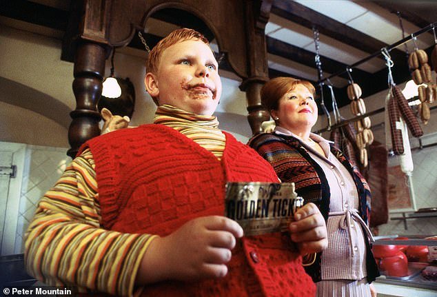 Willy Wonka's Oompa Loompas in Charlie and the Chocolate Factory have now been made gender neutral and new editions no longer use the word 'fat'.  Pictured: Augustus Gloop and Mrs. Gloop in the 2005 film