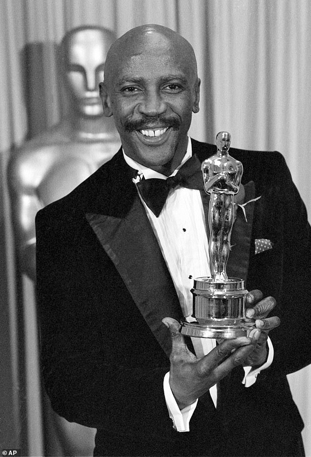 Gossett Jr.  poses with the Oscar for Best Supporting Actor for his role in An Officer and a Gentleman, in 1983. He became the first black man to win the gong for Supporting Actor
