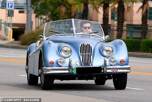 Before the boat ride, Brooklyn was seen spinning through the streets in a light blue electric Jaguar XK140