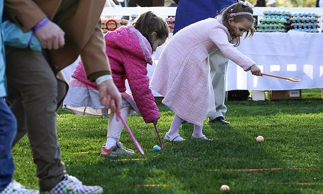 Children participate in the 2023 White House Easter Egg Roll event, held on the South Lawn for nearly 50 years