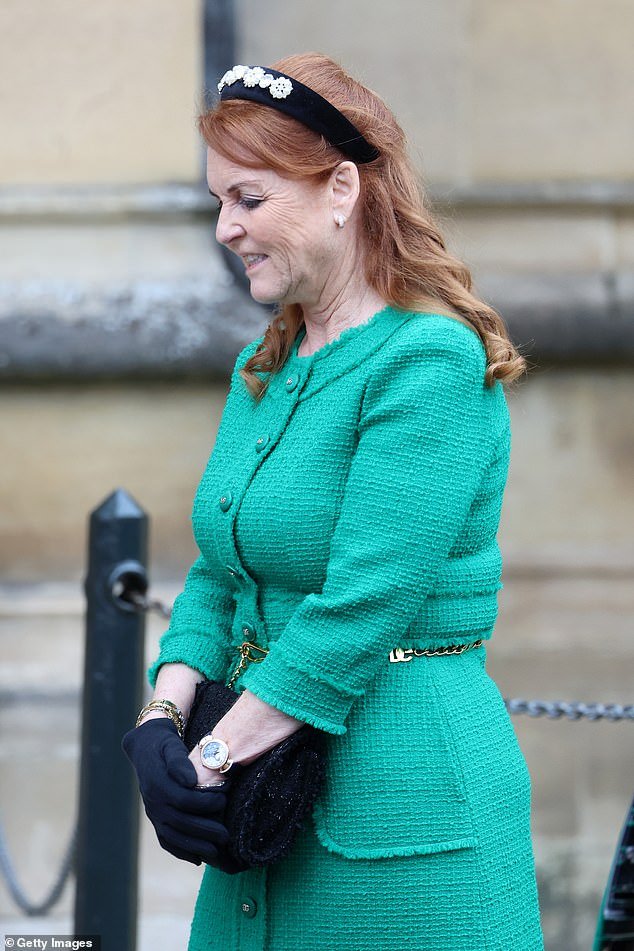 The Duchess of York completed the look with a pair of black gloves, a black floral headband and gold jewelry
