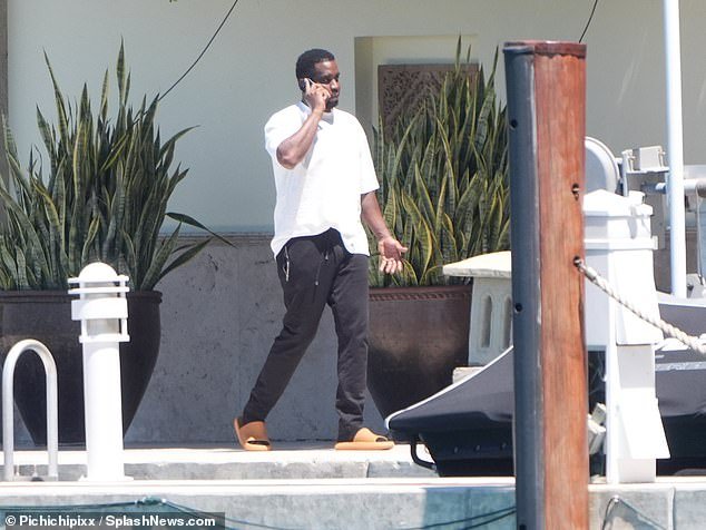 The 54-year-old rapper, real name Sean Combs, was spotted walking along the waterfront pier at his $35 million mansion in Miami
