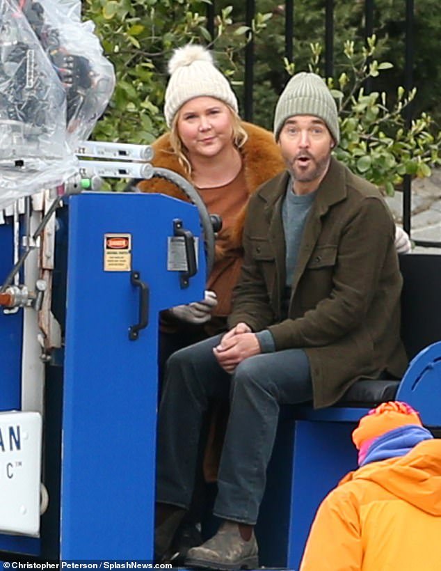 Amy Schumer, 42, smiled brightly as she took a ride on a Zamboni while filming the upcoming comedy, Kinda Pregnant, with co-star Will Forte, 53, on Wednesday in New York.