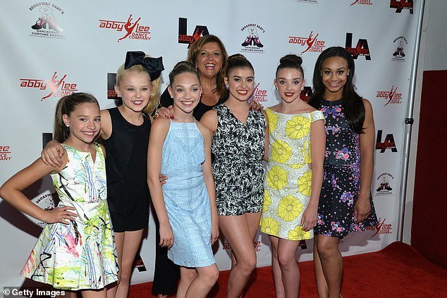 Ziegler – who appeared on TV at the age of nine on the Lifetime series Dance Moms – spoke about growing up in the public eye;  Ziegler (center) seen with her Dance Moms co-stars in 2015