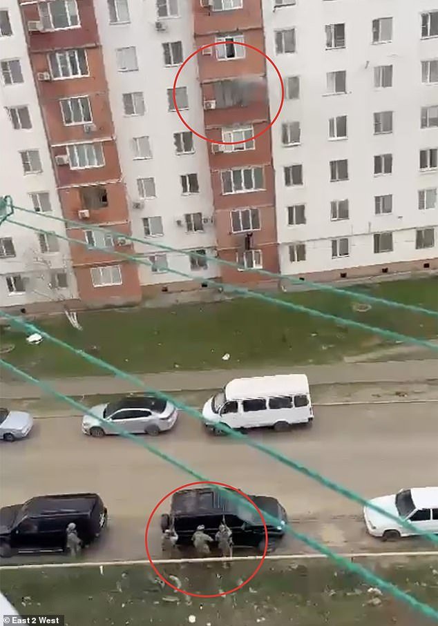 Smoke was seen coming from an apartment in the city of Kaspiysk before suspects were taken into custody