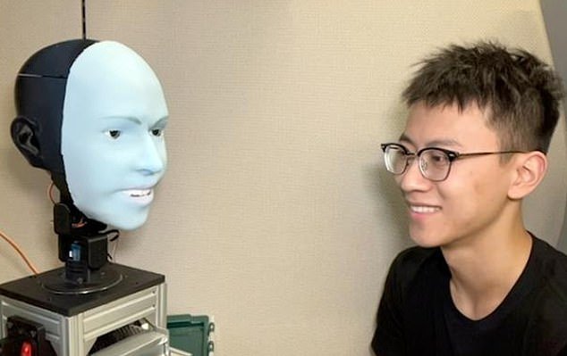 Researchers think that robots' nonverbal communication skills are being overlooked.  Emo is pictured here with Yuhang Hu of Creative Machines Lab