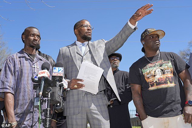 Michael Corey Jenkins, left, and Eddie Terrell Parker, right, stand next to lead attorney Malik Shabazz as they call on a federal judge Monday, March 18, 2024, to impose the harshest possible sentences