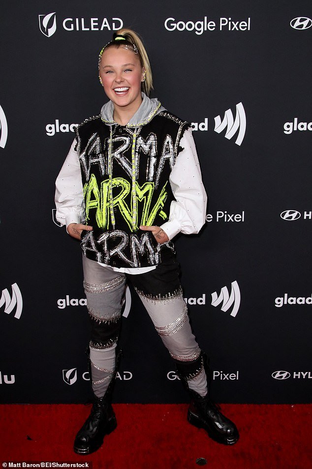 JoJo Siwa, 20, looked punk rock cool in a ripped hoodie and jeans at the 2024 GLAAD Media Awards in Los Angeles on Thursday