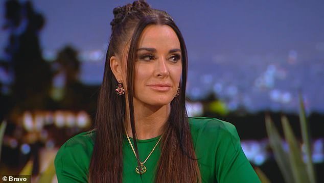Kyle Richards, 55, said she was 'curious' about kissing a woman as she discussed her steamy cameo in singer Morgan Wade's 29-year-old music video 'Fall In Love With Me' last year