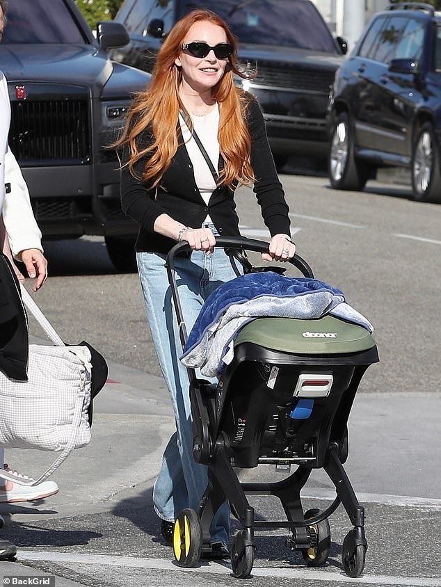 Lindsay Lohan, 37, was a doting mom as she enjoyed a relaxing family outing on Saturday while grabbing lunch at La Scala in Beverly Hills