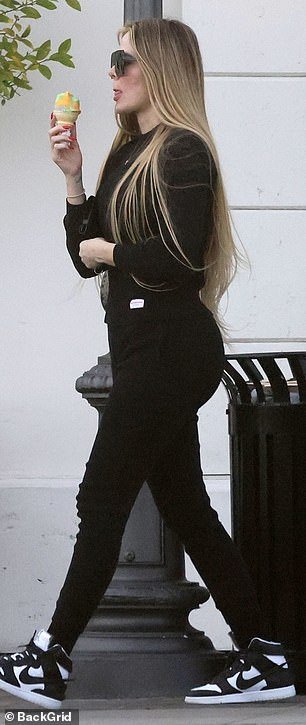 Khloe's look highlighted her slim frame and famous backside