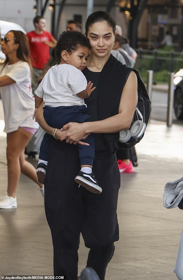 Shanina Shaik, 33, (pictured) was spotted arriving at Sydney Airport without make-up with son Zai, one, on Wednesday