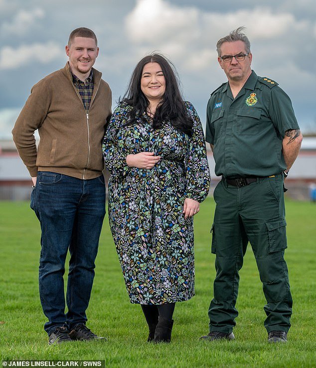 Both survived when another 999 crew members came to help, and they have now been reunited to highlight the importance of learning CPR.  Pictured with Daisy's husband, Eammon (left)
