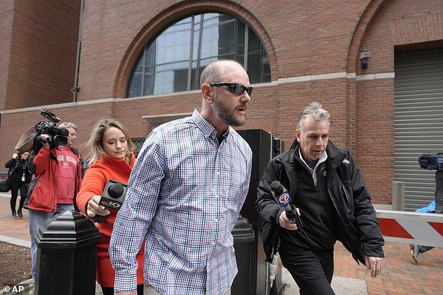 Jack Michael Teixeira, center, father of Massachusetts Air National Guardsman Jack Teixeira, leaves federal court, Monday, March 4, 2024, in Boston