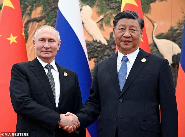 Vladimir Putin will travel to China for talks with Xi Jinping in May, according to reports (pictured together last year)