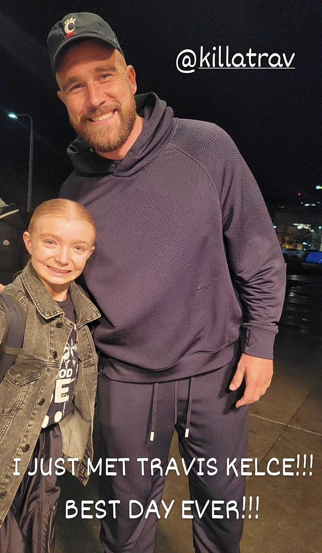 Travis Kelce posed for a photo with a young fan in Cleveland on Friday evening