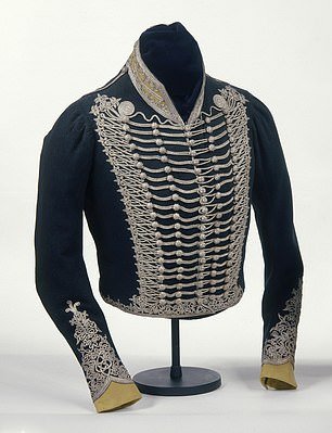 It can be seen next to a deep blue uniform jacket designed by George himself.  The deep blue military jacket is lined with white silk and has silver lace on the chest, along with five rows of wooden buttons