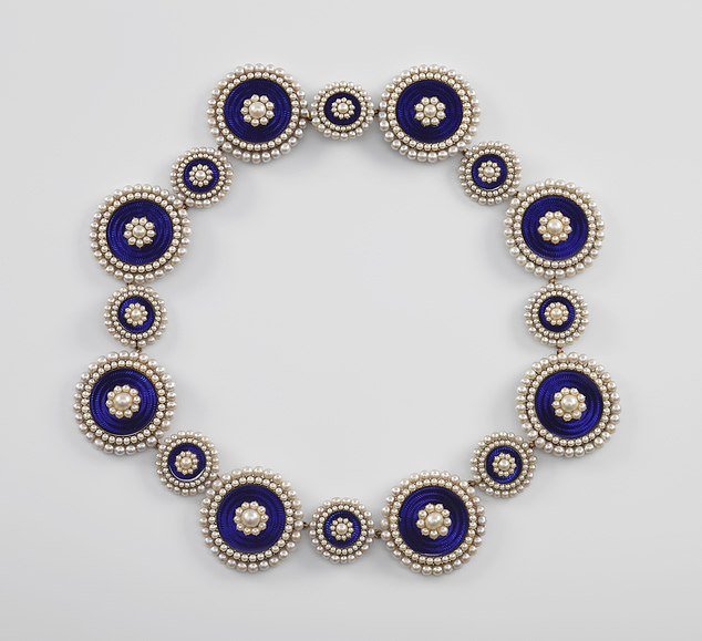 A necklace made from the buttons of King George III.  Clothing and jewelry in the Georgian era were often reused