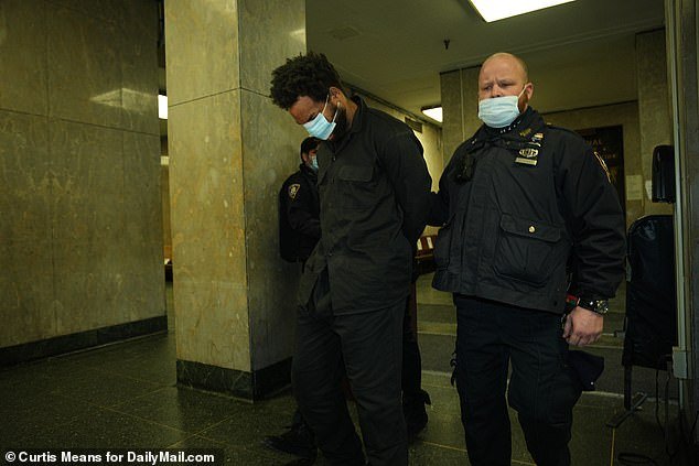 Pictured: Israel is charged in Manhattan Criminal Court with assault and robbery for hitting and beating a Good Samaritan who tried to give him a jacket in January 2022
